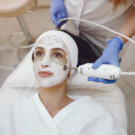 Woman receiving a facial treatment in the studio