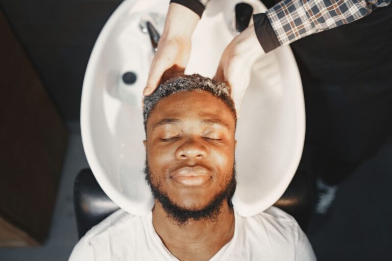 Man having his hair washed and scalp massaged
