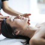Woman enjoying a calming scalp massage
